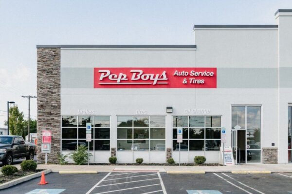 "Pep Boys Auto Service & Tires" sign on exterior of building