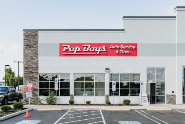 "Pep Boys Auto Service & Tires" sign on exterior of building