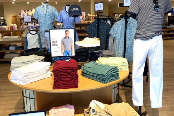 Interior of J.Crew Factory. View of mannequin wearing men's clothing.